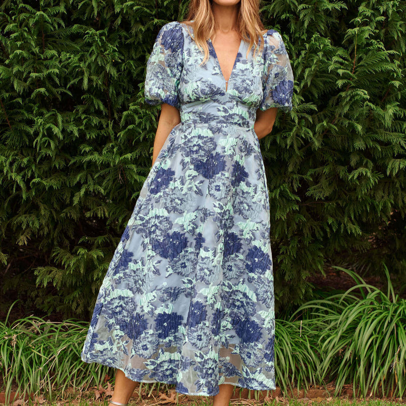 Opulence Midi Dress In Blue - Floral Organza Jacquard, available at: https://www.daltik.com/