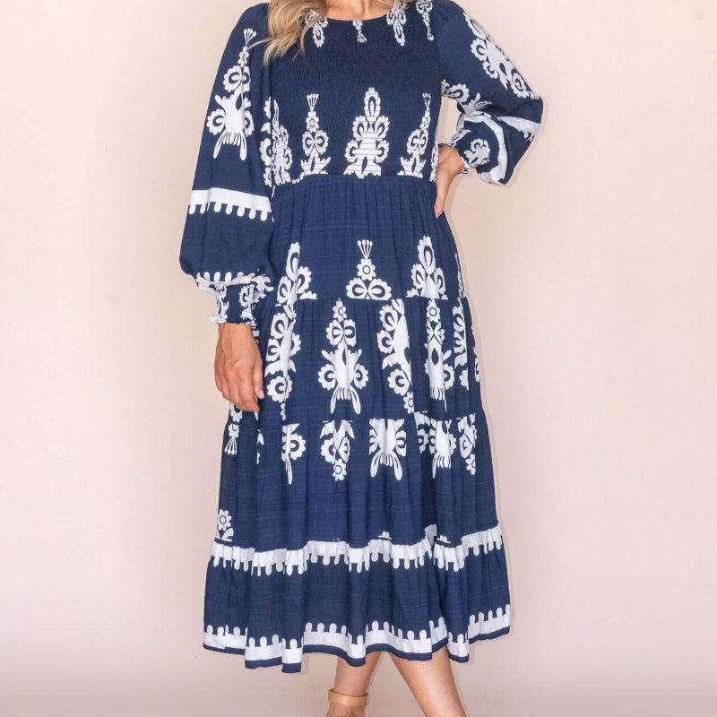 Whisper Midi Dress in Navy, available at: https://www.daltik.com/
