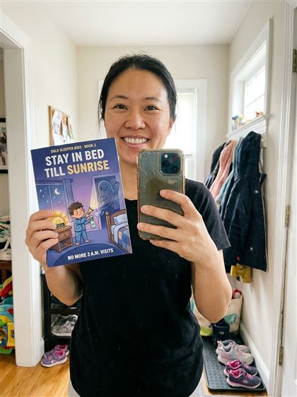Mom taking a selfie with Book 3